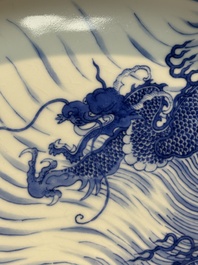 A rare large imperial Chinese blue and white 'dragon and carps' basin, Kangxi mark and of the period