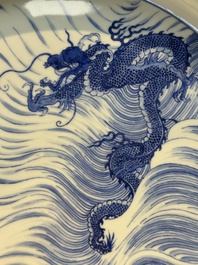 A rare large imperial Chinese blue and white 'dragon and carps' basin, Kangxi mark and of the period