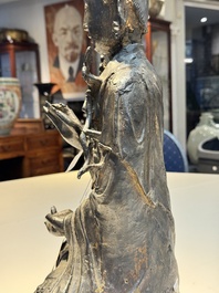 A large Chinese bronze Bodhisattva on wooden stand, Ming