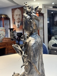 A large Chinese bronze Bodhisattva on wooden stand, Ming