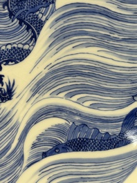 A rare large imperial Chinese blue and white 'dragon and carps' basin, Kangxi mark and of the period