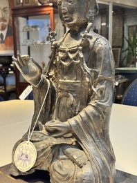 A large Chinese bronze Bodhisattva on wooden stand, Ming