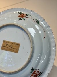 A Chinese famille verte 'elegant beauties in a garden' plate, Kangxi