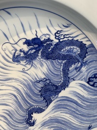 A rare large imperial Chinese blue and white 'dragon and carps' basin, Kangxi mark and of the period