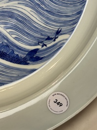 A rare large imperial Chinese blue and white 'dragon and carps' basin, Kangxi mark and of the period