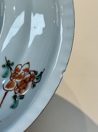 A Chinese famille verte 'elegant beauties in a garden' plate, Kangxi