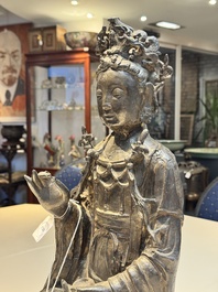 A large Chinese bronze Bodhisattva on wooden stand, Ming