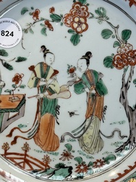 A Chinese famille verte 'elegant beauties in a garden' plate, Kangxi