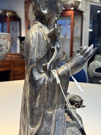 A large Chinese bronze Bodhisattva on wooden stand, Ming