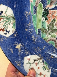 A Chinese famille verte powder-blue-ground 'landscape' dish, Kangxi