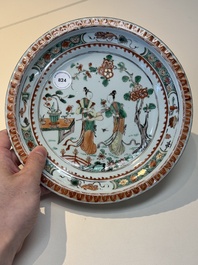 A Chinese famille verte 'elegant beauties in a garden' plate, Kangxi
