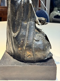 A large Chinese bronze Bodhisattva on wooden stand, Ming