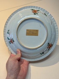 A Chinese famille verte 'elegant beauties in a garden' plate, Kangxi