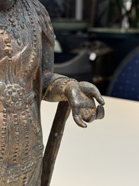 A fine and large Chinese bronze standing Buddha, Liao/Jin