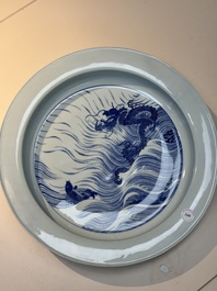 A rare large imperial Chinese blue and white 'dragon and carps' basin, Kangxi mark and of the period