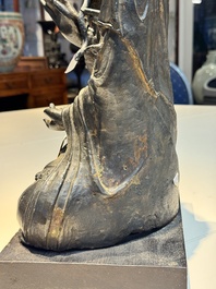 A large Chinese bronze Bodhisattva on wooden stand, Ming