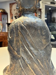 A large Chinese bronze Bodhisattva on wooden stand, Ming
