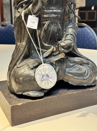 A large Chinese bronze Bodhisattva on wooden stand, Ming