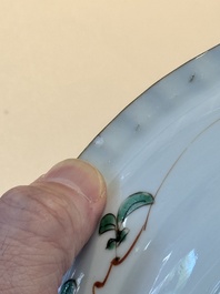 A Chinese famille verte 'elegant beauties in a garden' plate, Kangxi