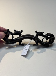 A Chinese bronze 'dragon' brush rest, Song/Yuan