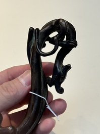 A Chinese bronze 'dragon' brush rest, Song/Yuan
