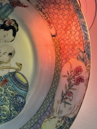 An extremely fine pair of Chinese famille rose ruby-back eggshell plates with a lady and playing boys, Yongzheng
