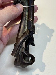 A Chinese bronze 'dragon' brush rest, Song/Yuan