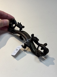 A Chinese bronze 'dragon' brush rest, Song/Yuan