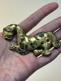 A rare Chinese gilt-bronze 'tiger' ornament, Han