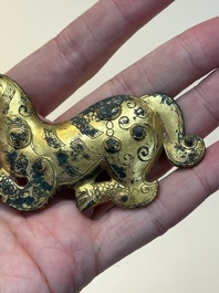 A rare Chinese gilt-bronze 'tiger' ornament, Han
