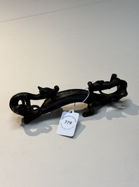 A Chinese bronze 'dragon' brush rest, Song/Yuan