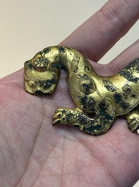 A rare Chinese gilt-bronze 'tiger' ornament, Han
