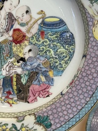 An extremely fine pair of Chinese famille rose ruby-back eggshell plates with a lady and playing boys, Yongzheng