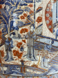 A large Chinese European-decorated blue and white fish bowl with narrative design, on a later wooden stand, Kangxi