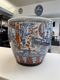 A large Chinese European-decorated blue and white fish bowl with narrative design, on a later wooden stand, Kangxi