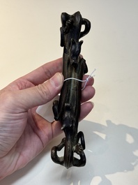 A Chinese bronze 'dragon' brush rest, Song/Yuan