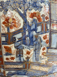 A large Chinese European-decorated blue and white fish bowl with narrative design, on a later wooden stand, Kangxi