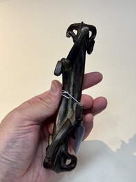 A Chinese bronze 'dragon' brush rest, Song/Yuan