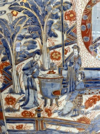 A large Chinese European-decorated blue and white fish bowl with narrative design, on a later wooden stand, Kangxi