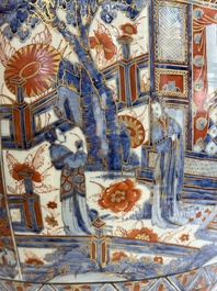 A large Chinese European-decorated blue and white fish bowl with narrative design, on a later wooden stand, Kangxi