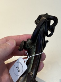 A Chinese bronze 'dragon' brush rest, Song/Yuan