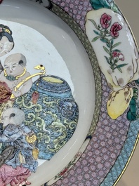 An extremely fine pair of Chinese famille rose ruby-back eggshell plates with a lady and playing boys, Yongzheng