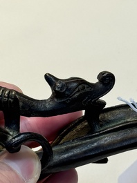 A Chinese bronze 'dragon' brush rest, Song/Yuan