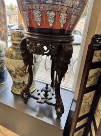 A large Chinese European-decorated blue and white fish bowl with narrative design, on a later wooden stand, Kangxi