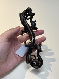 A Chinese bronze 'dragon' brush rest, Song/Yuan