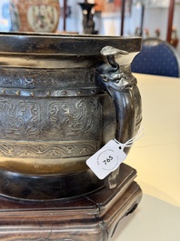 A Chinese archaistic bronze censer with 'chilong' and 'lingzhi' handles on wooden stand, Zhou Wang Bo Zuo Bao Ding 周王伯作寶鼎 mark, Yuan/Ming