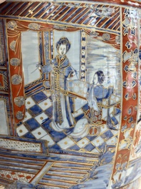 A large Chinese European-decorated blue and white fish bowl with narrative design, on a later wooden stand, Kangxi