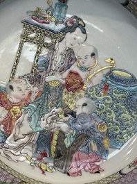 An extremely fine pair of Chinese famille rose ruby-back eggshell plates with a lady and playing boys, Yongzheng