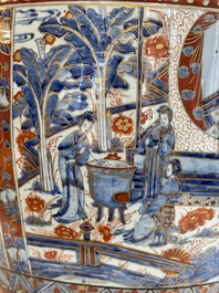 A large Chinese European-decorated blue and white fish bowl with narrative design, on a later wooden stand, Kangxi