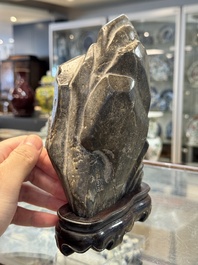 A Chinese Lingbi stone scholar's rock on wooden stand, Yun Tai 雲台 mark, 19/20th C.
